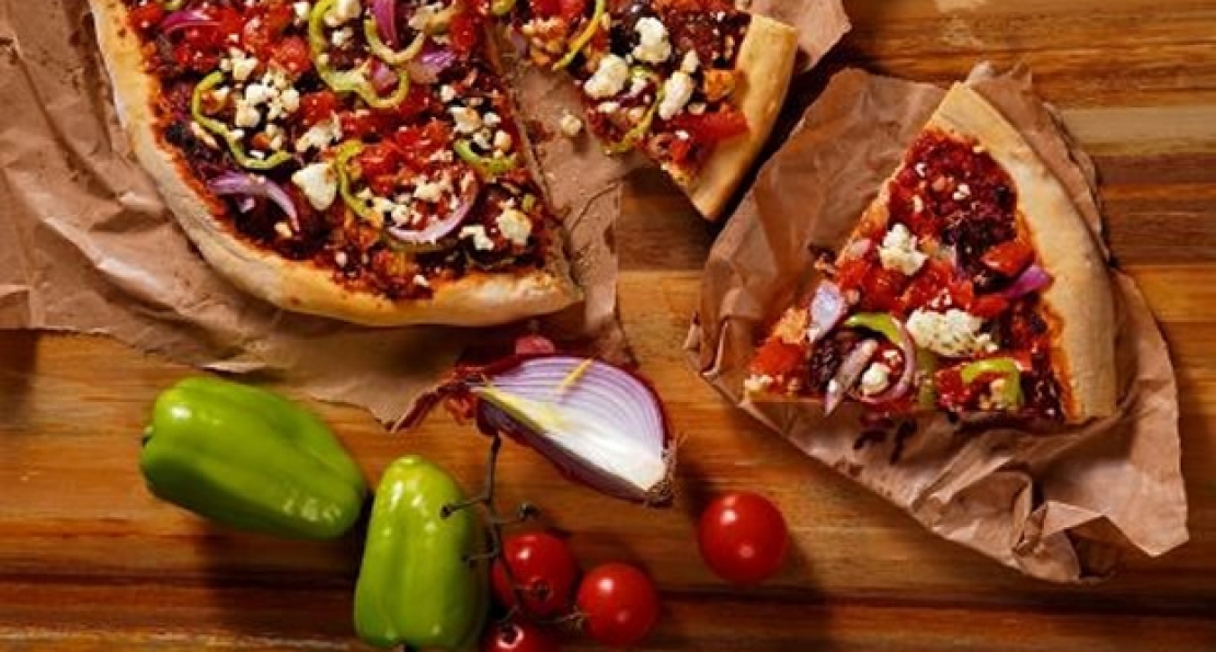 Pizza &quot;horiatiki&quot; with feta cheese, sausage and fresh tomato