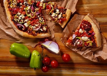 Pizza "horiatiki" with feta cheese, sausage and fresh tomato